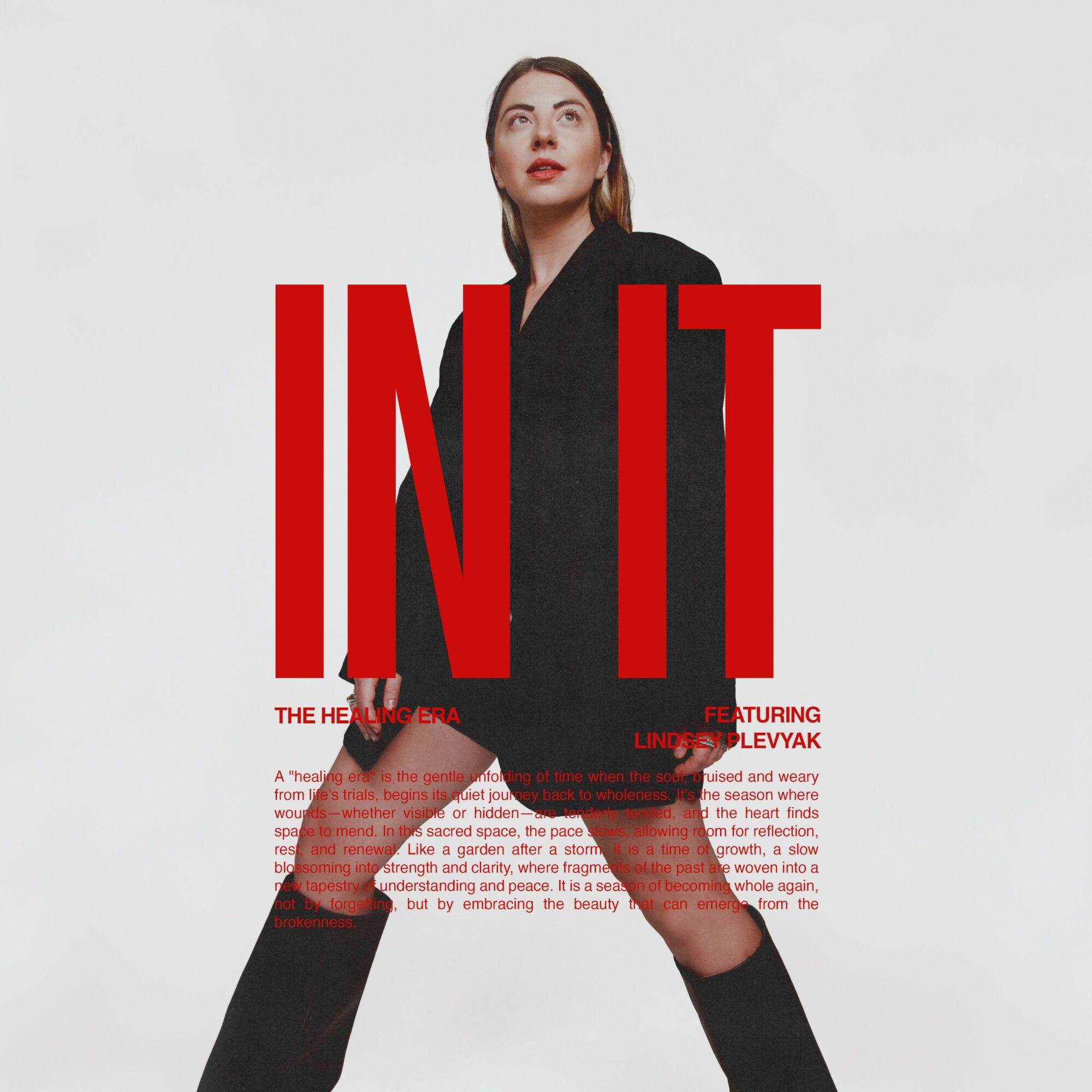 Woman in black blazer and shorts standing with legs apart against a white background, large red text overlay.