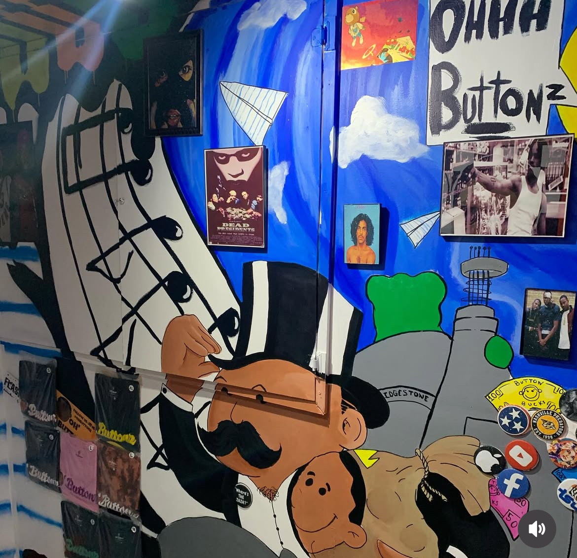 Colorful wall with cartoon character, posters, and various objects including a dog and a green object.