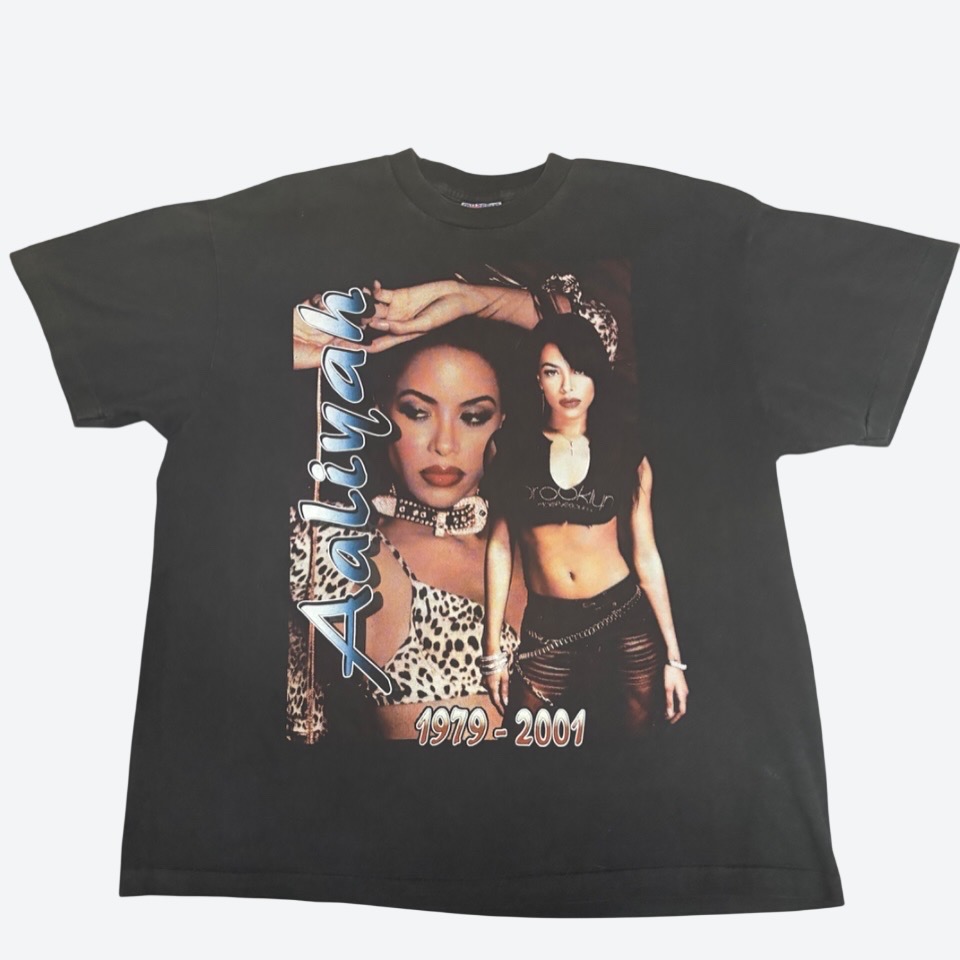 Black T-shirt with a graphic of a woman, text, and dates, featuring a woman with dark hair and makeup.