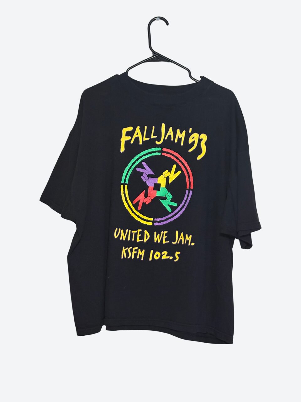 Black T-shirt with colorful circular logo and yellow text, hanging on a hanger against a white background.