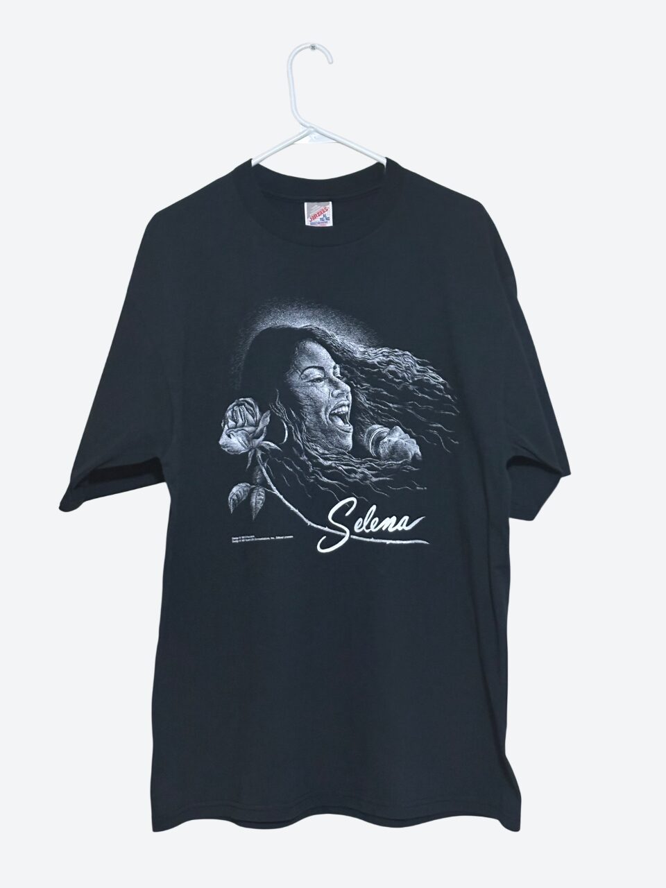Black T-shirt with a graphic of a woman with long hair and a rose, and the name 'Selma' written below.
