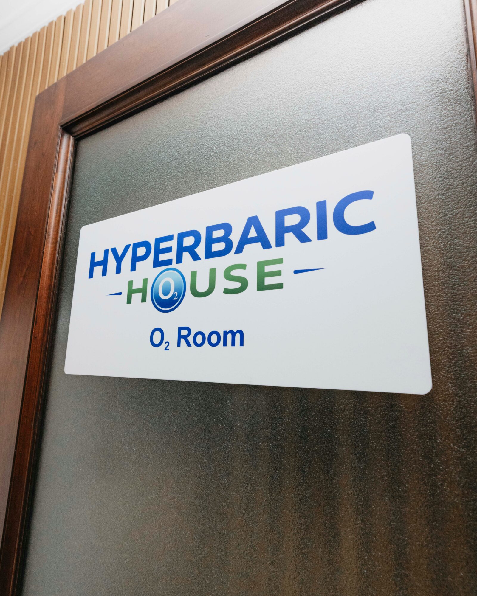 Sign on door reads 'HYPERBARIC HOUSE' with additional text 'O2 Room'.