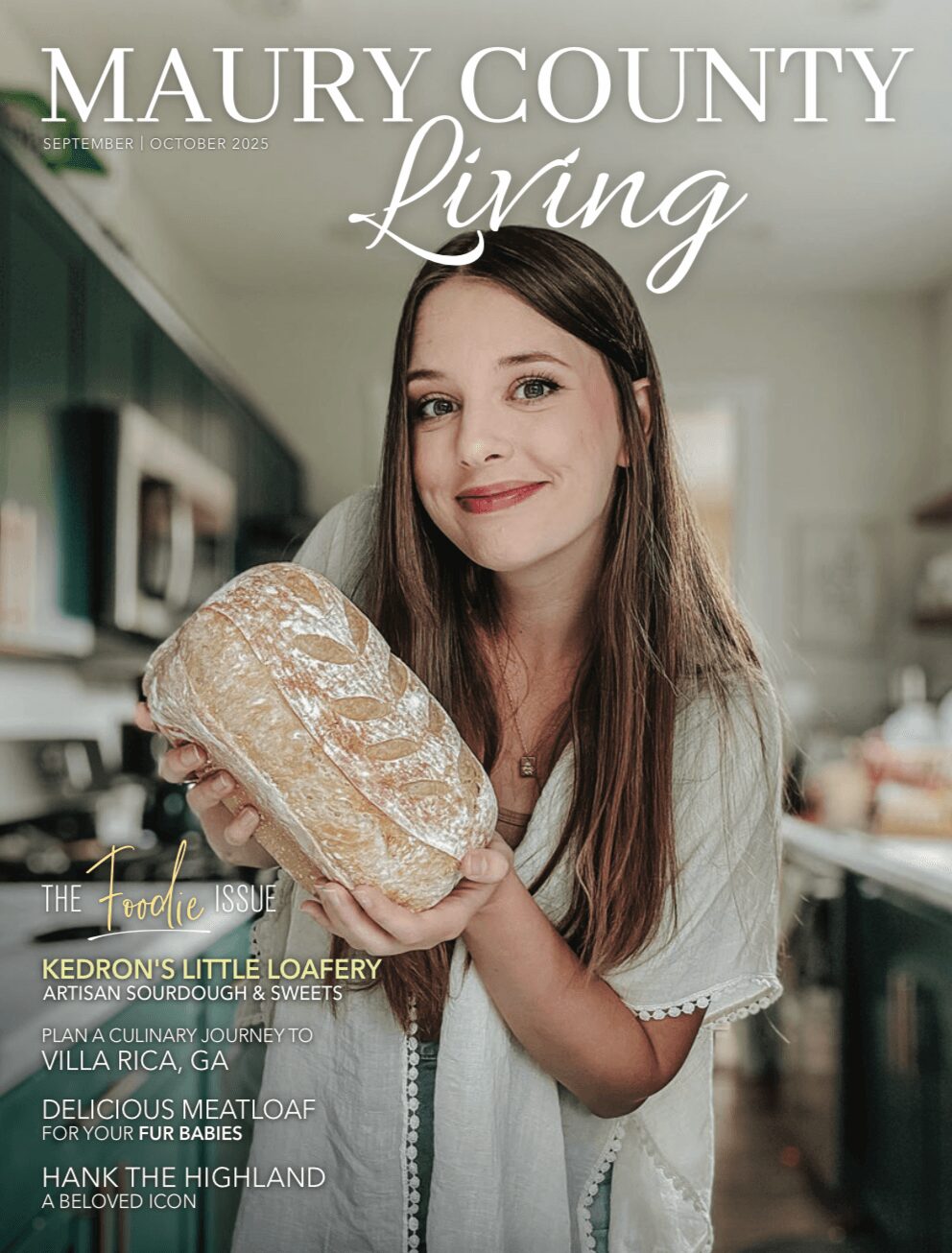 Young woman with long brown hair holding a loaf of bread in a kitchen, smiling. Magazine cover titled 'Maury County Living'.