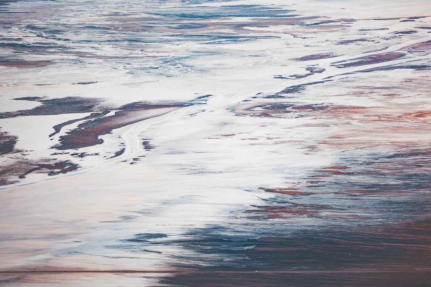 Abstract sky with clouds and streaks of color, resembling a painted landscape.
