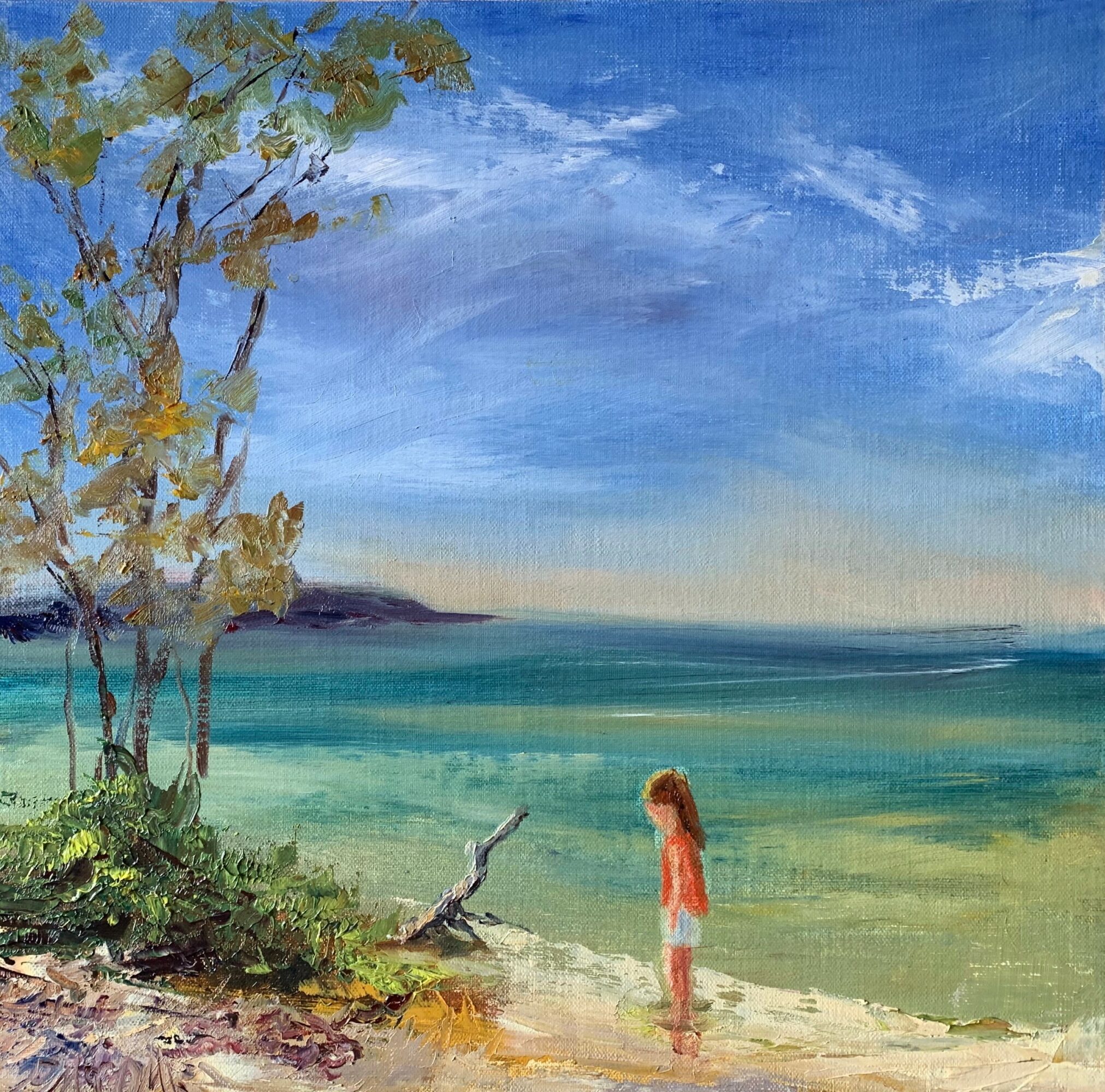 A girl with long hair stands on a beach near water, with trees and a cloudy sky in the background.