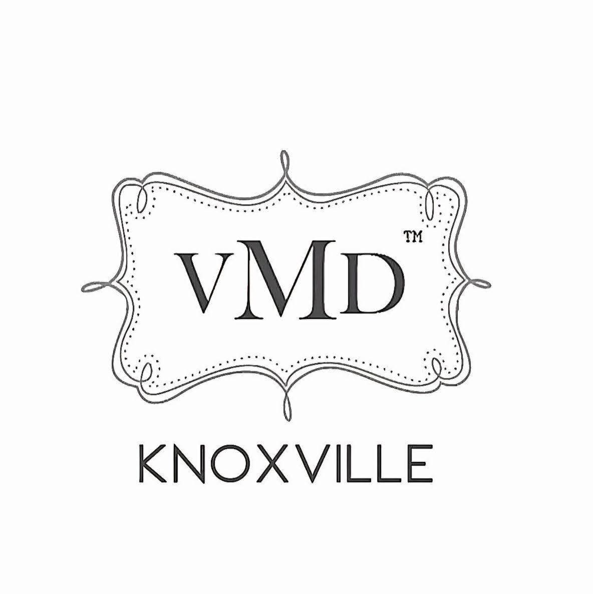 Stylized logo with the text 'vMD' inside a decorative frame and 'KNOXVILLE' below, in black and white.