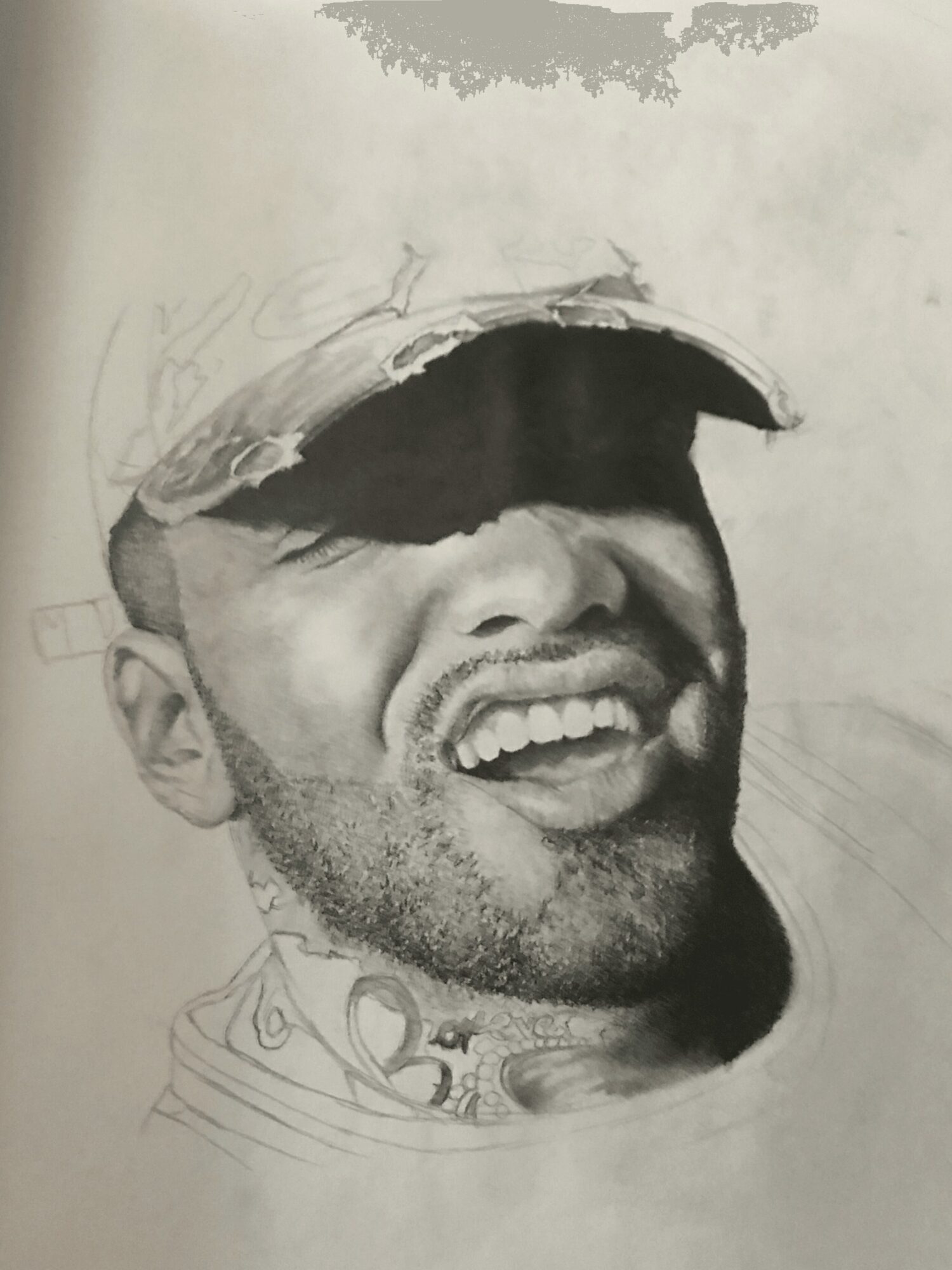 Sketch of a smiling man wearing a cap, with detailed facial features and beard, in progress.