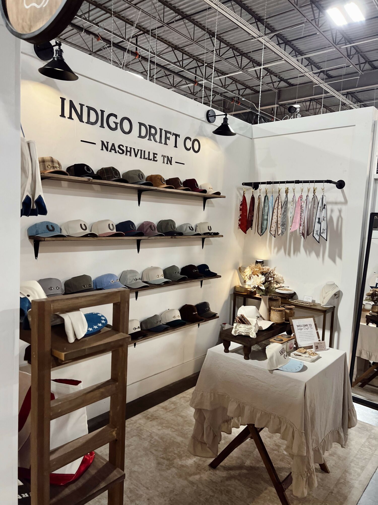 Interior of a store with shelves displaying shoes, a sign reading 'INDIGO DIPO CO NASHVILLE TN,' and a table with various items.