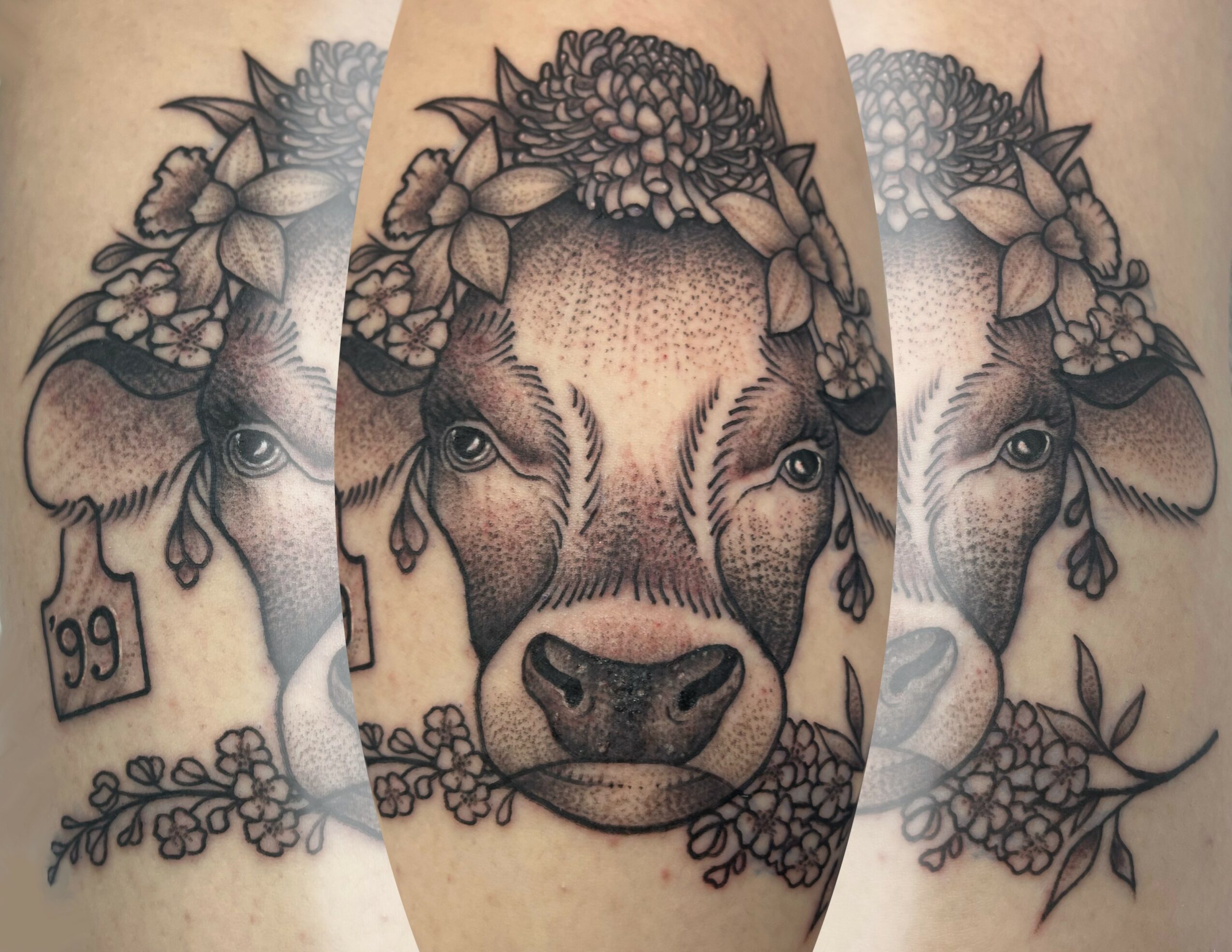 Detailed black and gray tattoo of a deer's face with floral elements and a small tag with the number 99.