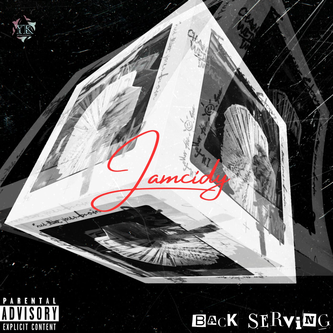 A black and white cube with images and text, featuring a red signature-style word, and parental advisory label.