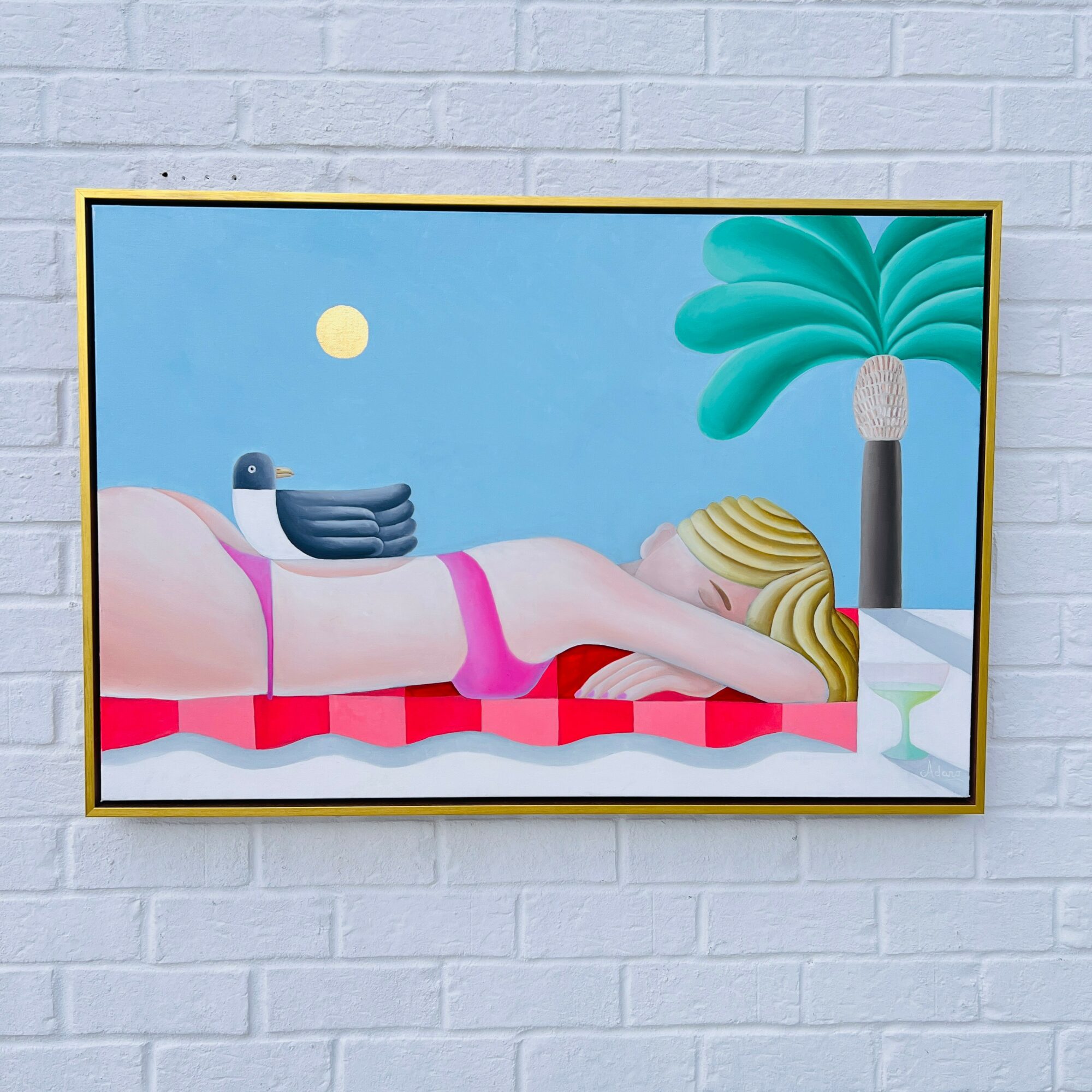 Person lying on a pink and red striped lounge chair outdoors, with a palm tree and a yellow sun in the background.