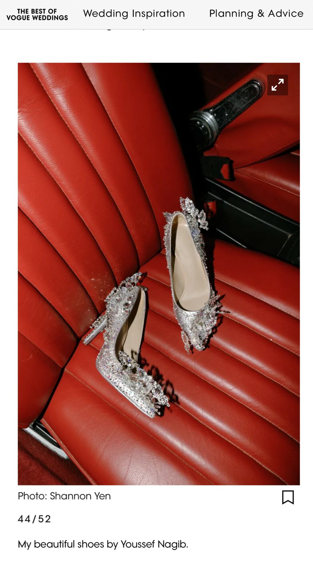 Red car seat with silver high-heeled shoes decorated with rhinestones placed on it.