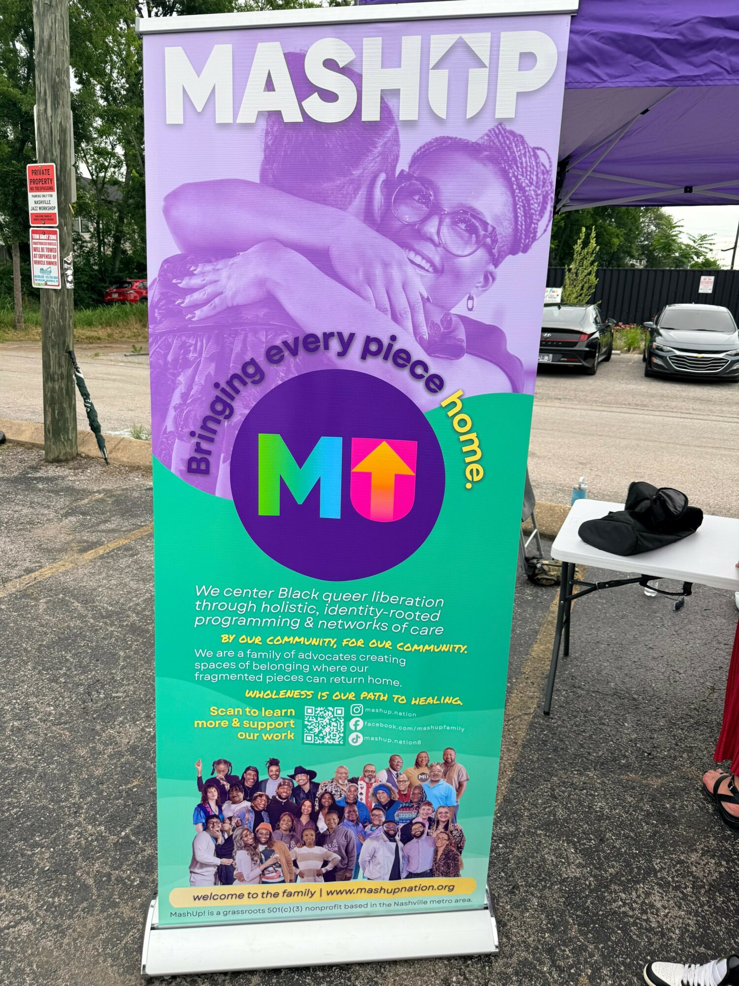 Banner with a purple background, a person wearing glasses, and colorful text promoting a community event, with a group photo at the bottom.