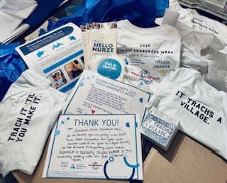 Various printed materials and items related to healthcare awareness and thank you notes on a table.