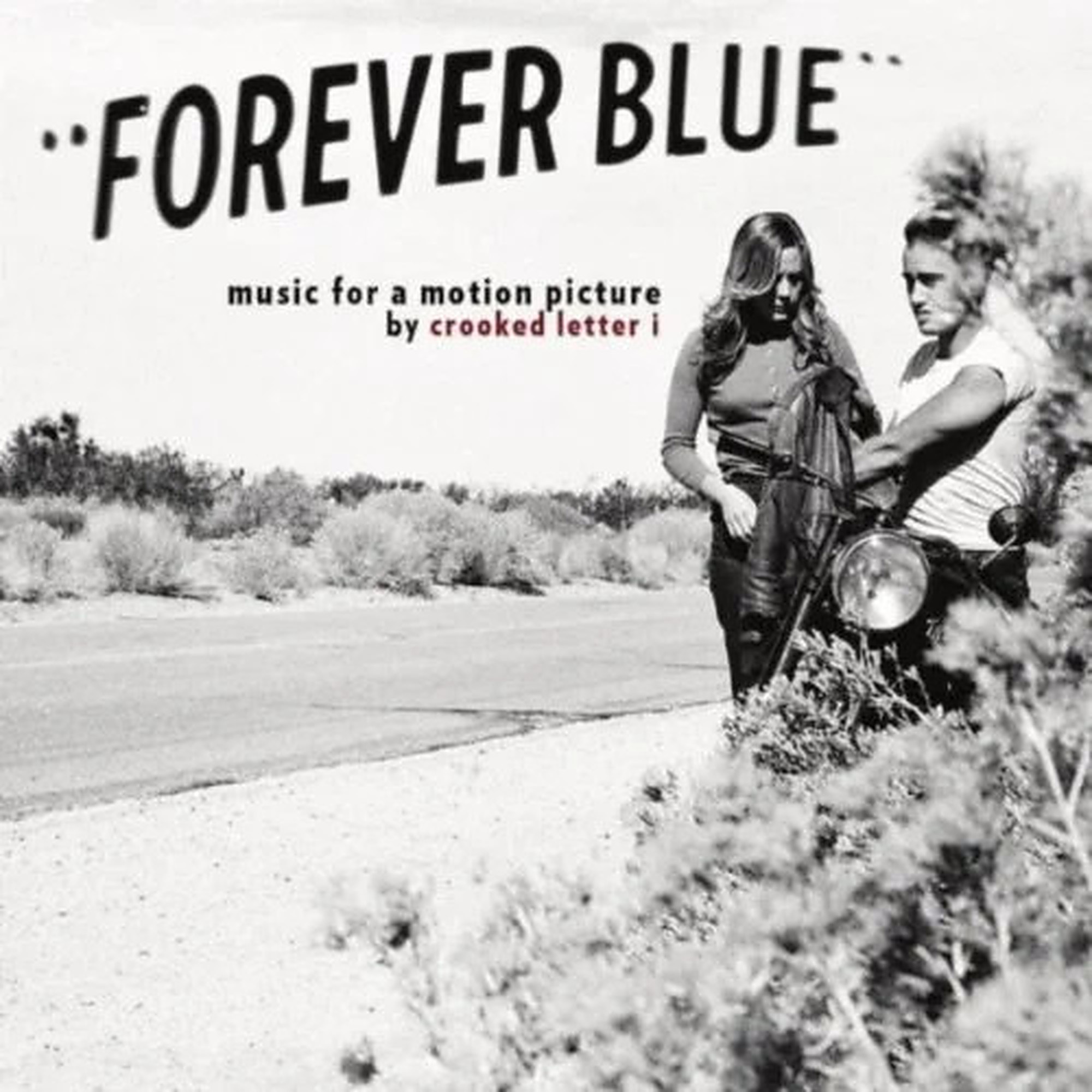 Two women standing outdoors near a motorcycle, with text 'FOREVER BLUE' and additional smaller text, in black and white.