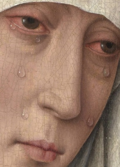 Close-up of a person's face with tears on cheeks, eyes red, and a neutral expression.