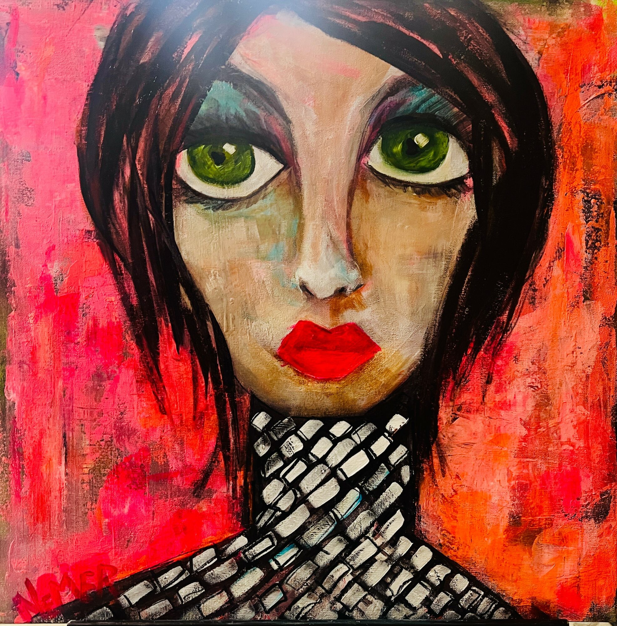 Portrait of a woman with large green eyes, red lips, black hair, and a patterned neck against a red background.