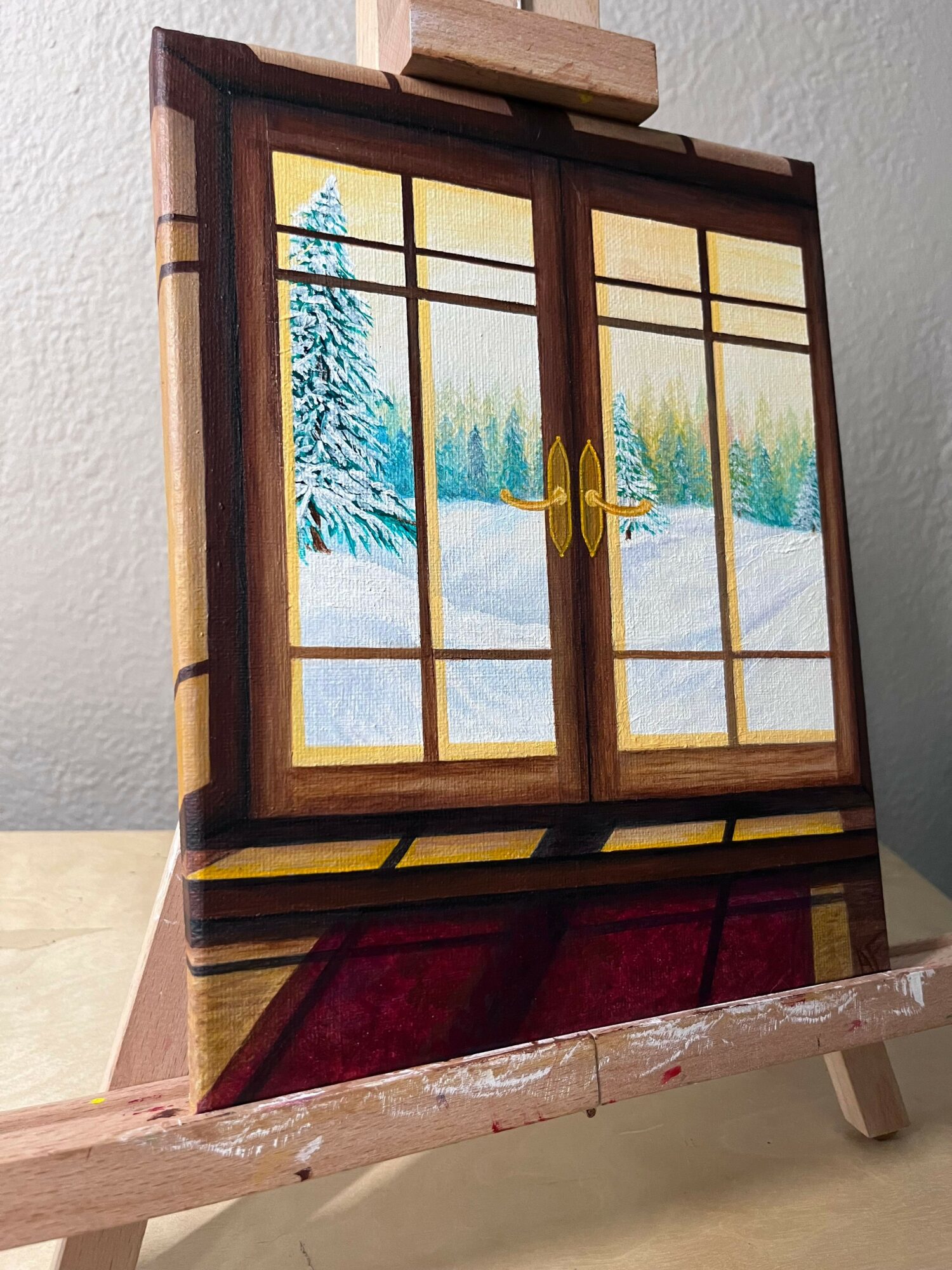 Stained glass cabinet with a landscape scene, wooden frame, and a red velvet interior, viewed from the side.