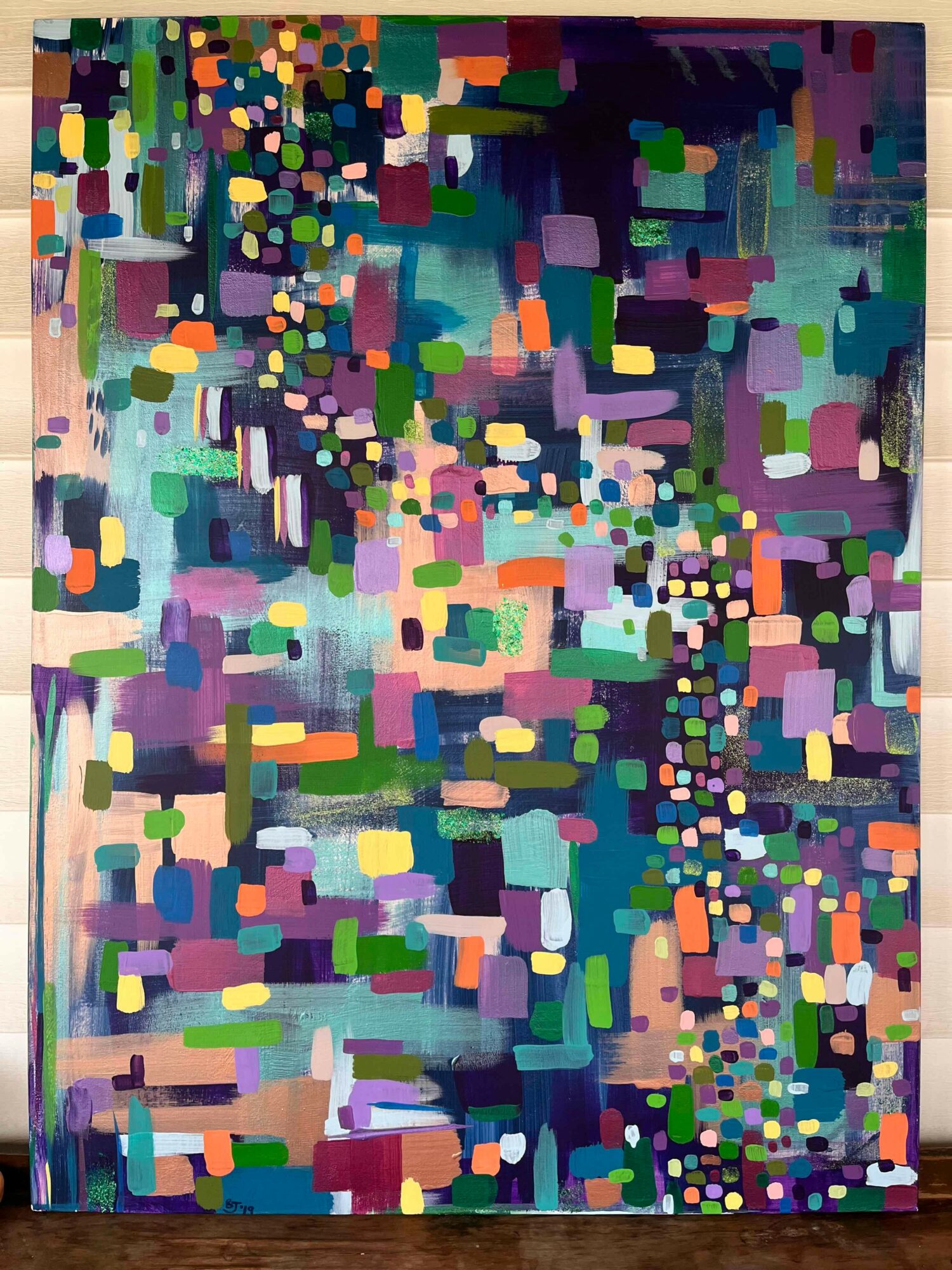 Abstract colorful pattern with various shapes and sizes, resembling a cityscape or digital mosaic.