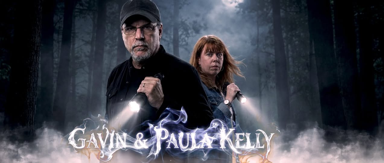 Two people stand in a foggy forest with text reading 'Gavin & Paula Kelly' at the bottom.