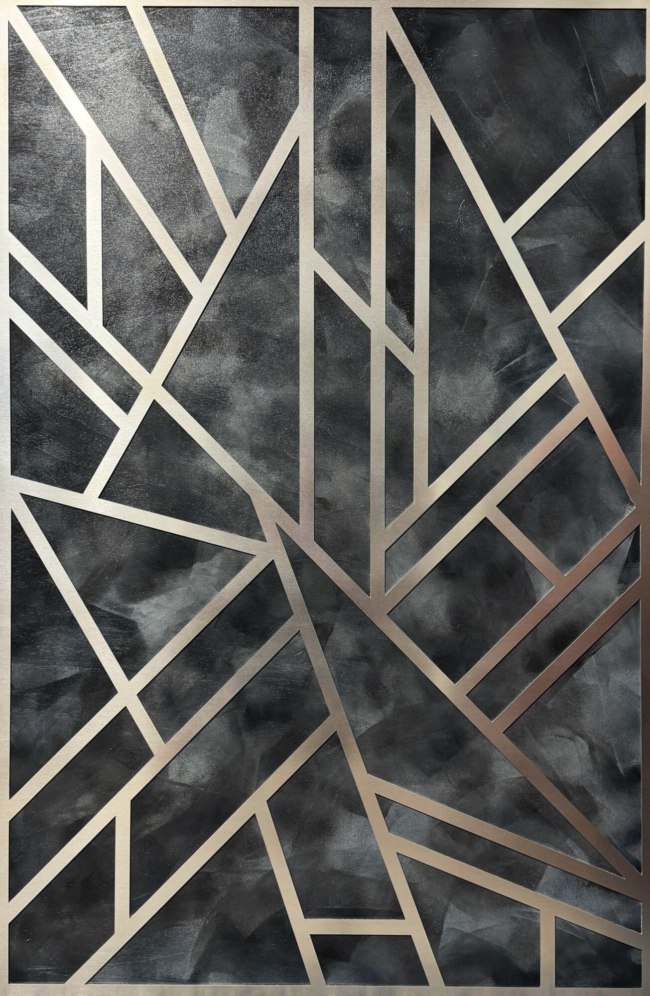 Abstract geometric pattern with intersecting lines over a cloudy dark background.