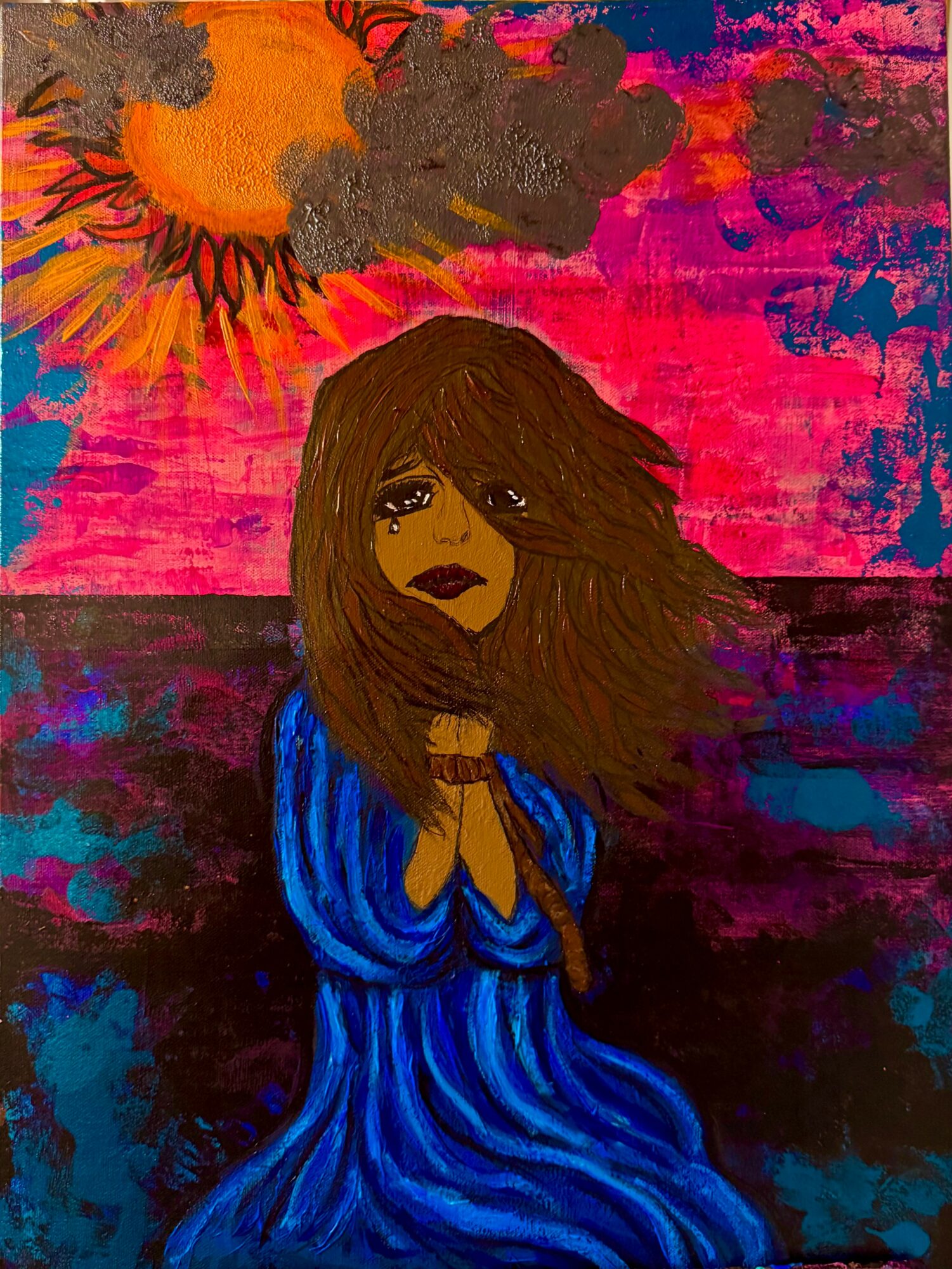 A woman with long brown hair and dark lipstick wearing a blue dress, standing by water with a colorful sky background.